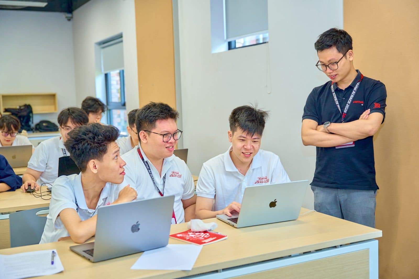 The team debugging at their laptops